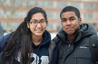 Two students smiling