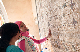 Students exploring a mosaic